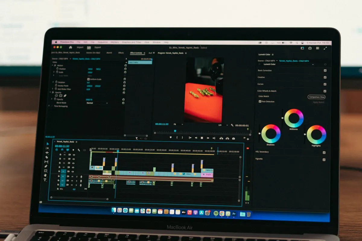 Video editing software open on a laptop, with a clip laid out along a timeline.